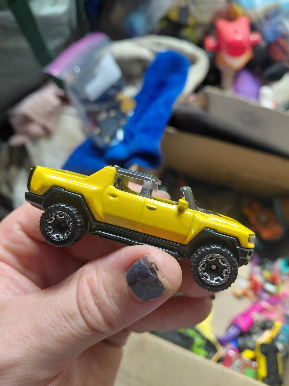 2022 Hot Wheels GMC Hummer EV pickup in yellow.